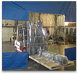 Heavy-duty vinyl curtain wall door panel designed for easy passage through large curtain wall partitions