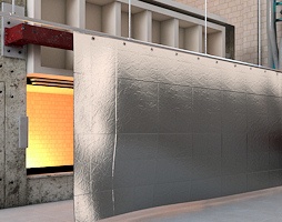 Heavy-duty industrial oven curtains fitted over a large oven opening, designed to retain heat and improve energy efficiency in manufacturing operations.
