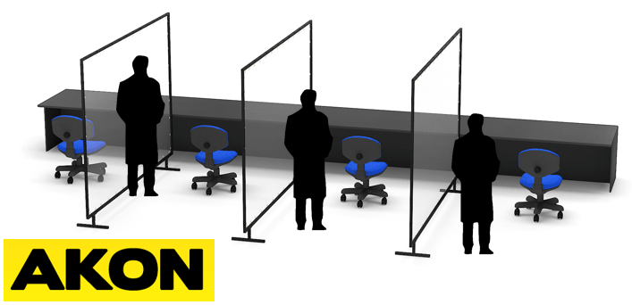 Clear social distancing divider curtains with support stands separating workstations in an industrial or retail environment.
