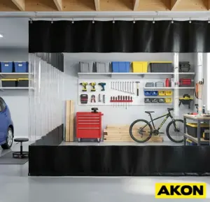 A bespoke curtain divider installed in a garage to separate work areas or block off a section of the space.