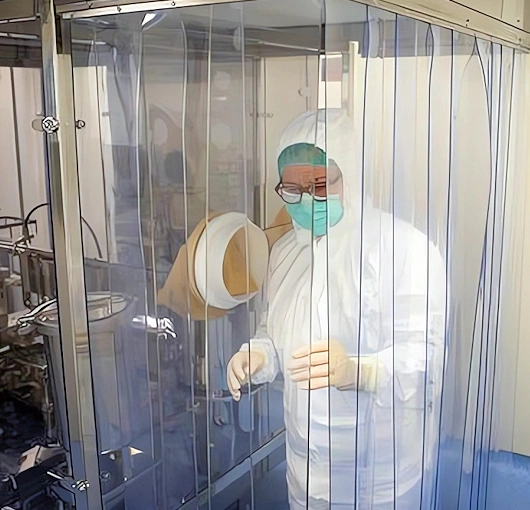 ESD anti-static strip curtains installed in a production environment, designed to control electrostatic discharge while allowing easy access and visibility through workstation partitions