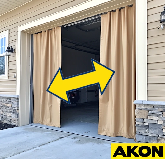 Retractable insulated garage curtain wall on a ceiling track, offering easy side-to-side operation and efficient space coverage