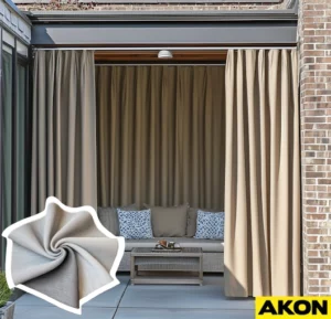 Neutral beige outdoor curtains installed on a covered patio, framing a comfortable seating area and providing privacy and sun protection.