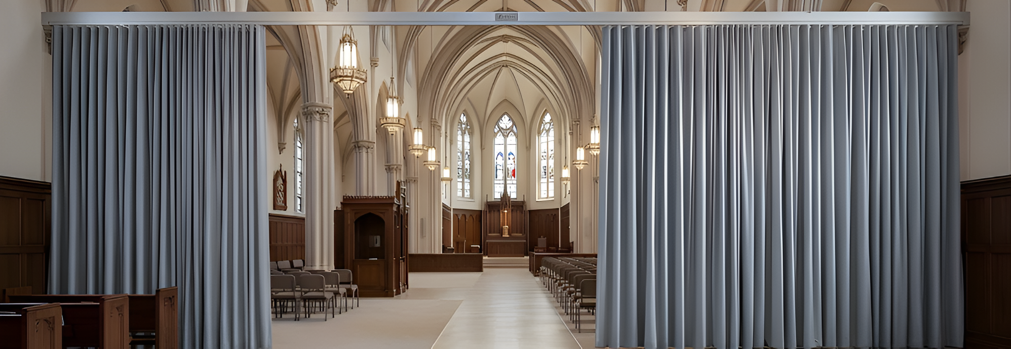 Light grey church divider curtain creating a partition inside a large cathedral interior