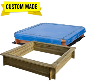 Weighted outdoor sandpit cover laid over a commercial or playground sandpit to protect the sand from weather and debris.