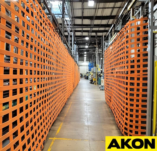 Warehouse retractable barrier rails using netting