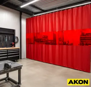 Close-up of flame-resistant welding curtain material used to shield workers and equipment from weld spatter and UV radiation.
